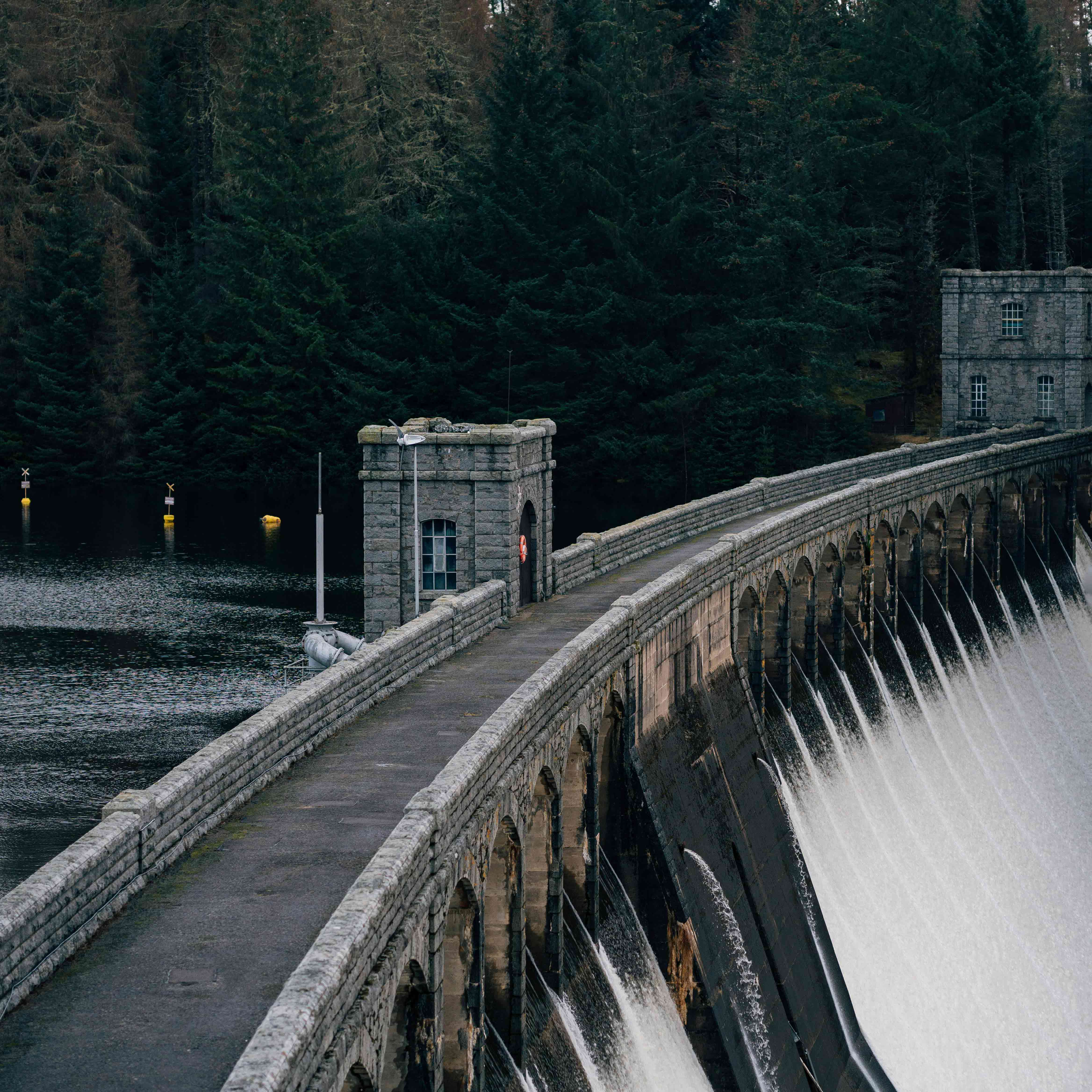 water flowing through a man-made dam